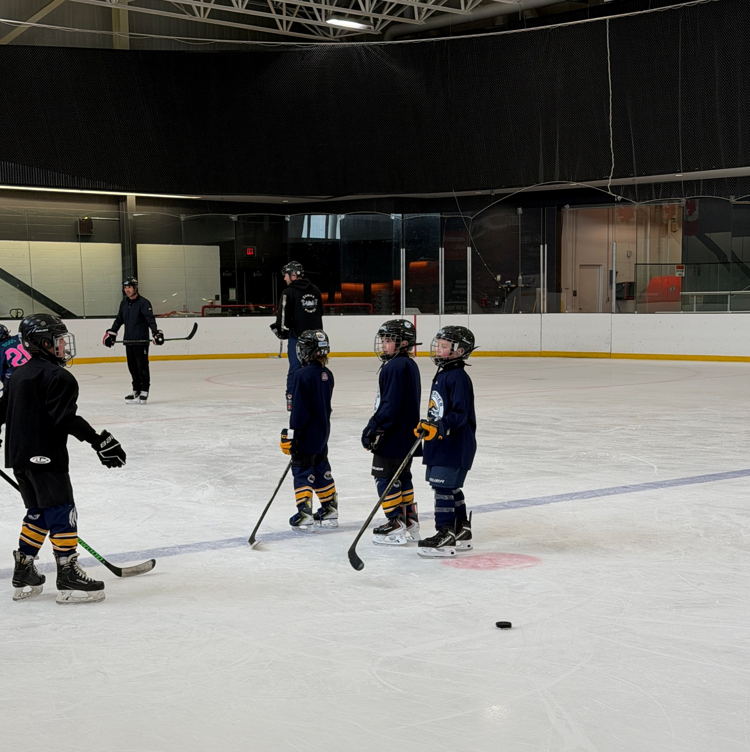 Coach instructing young players at Great Plains session