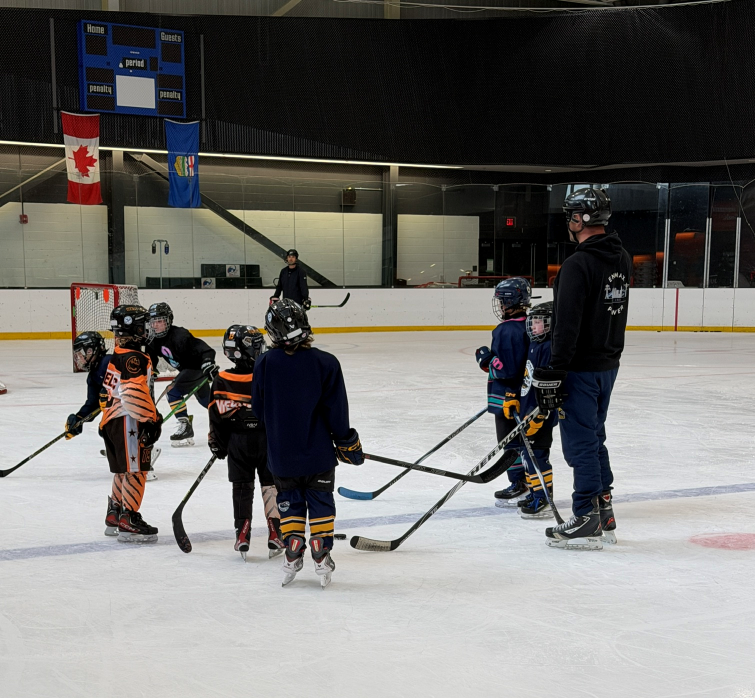 Players lined up on the ice during Great Plains session